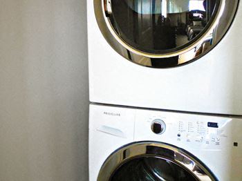 Stackable washer and dryer in apartments at The Hills Apartments in North Kansas City, MO